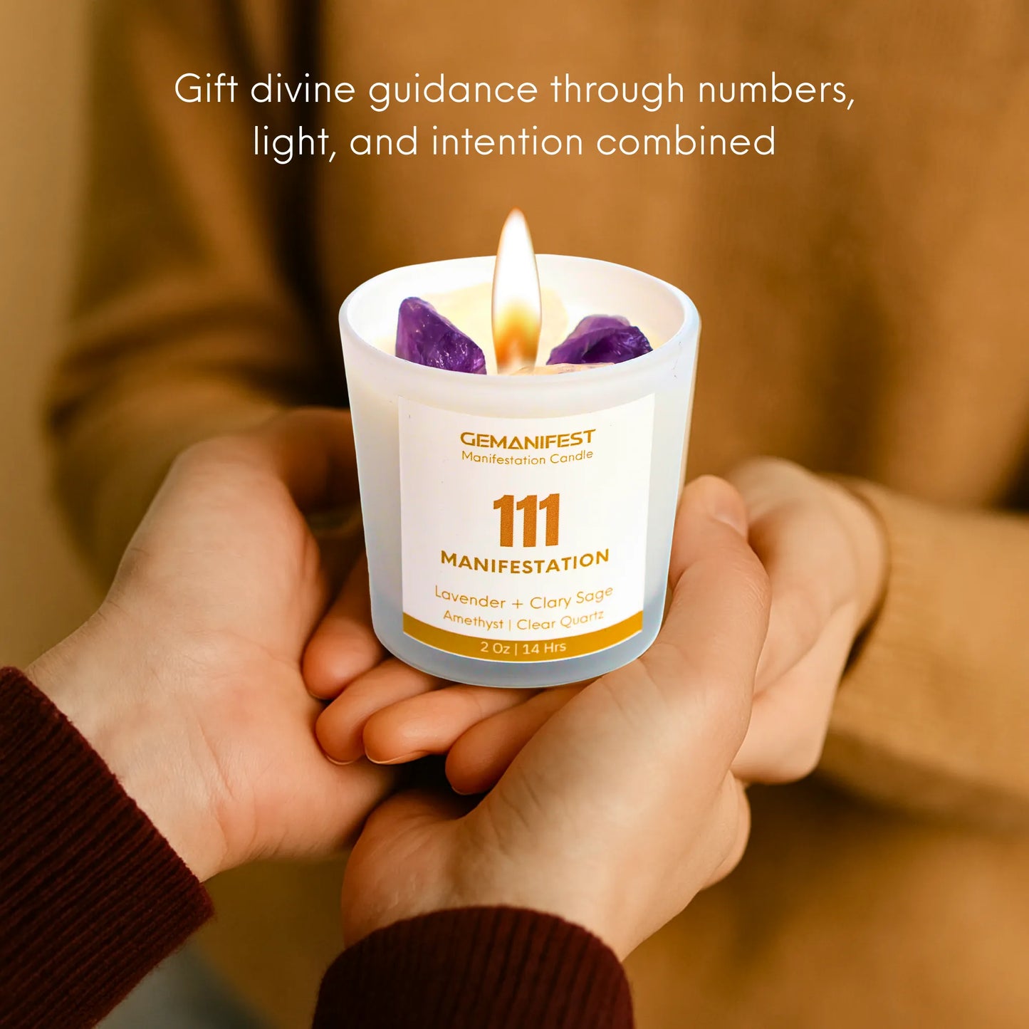 Candle labeled '111 Manifestation' held by two hands with a blurred background