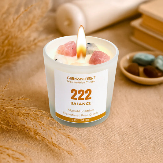 Gemanifest 222 Balance candle with a flame on a textured surface