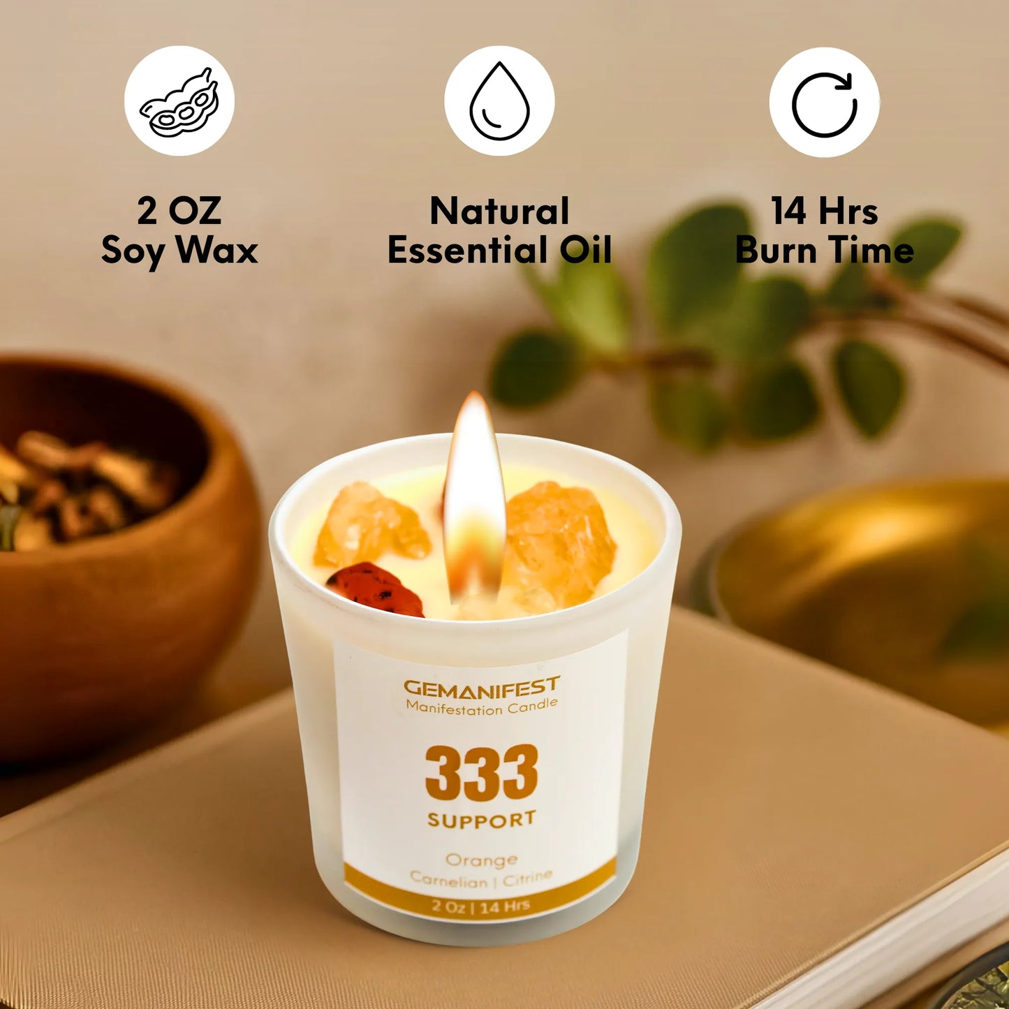 Candle with '333 Manifestation Candle' label on a surface with icons and text about soy wax, essential oil, and burn time.