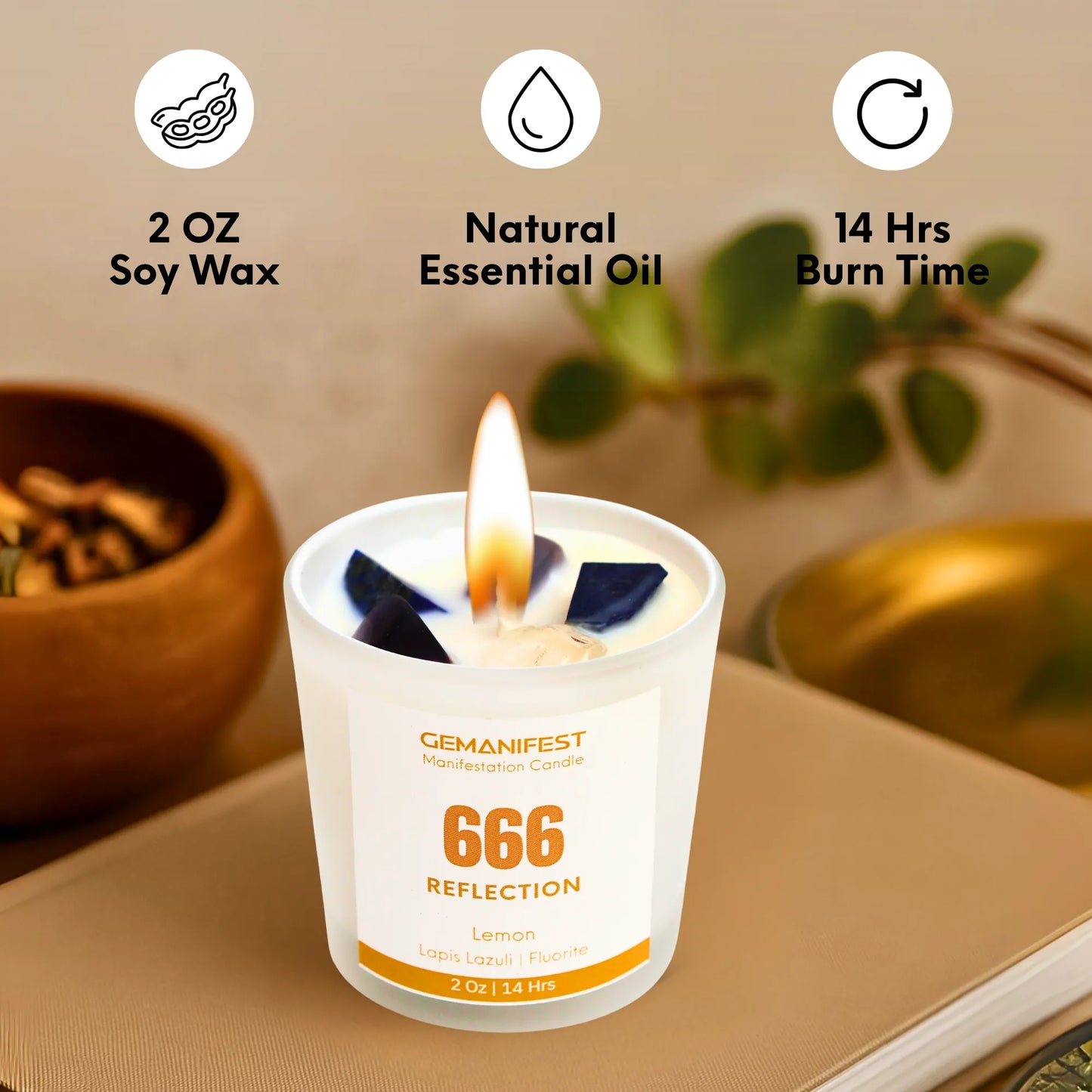 Candle with 'GEMANIFEST' branding on a surface with icons and text about soy wax, essential oil, and burn time.