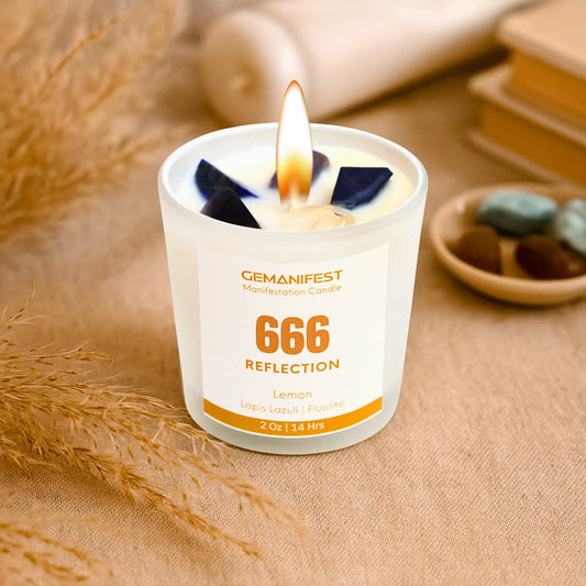 Gemanifest angel number candle labeled '666 Reflection' on a beige surface.
