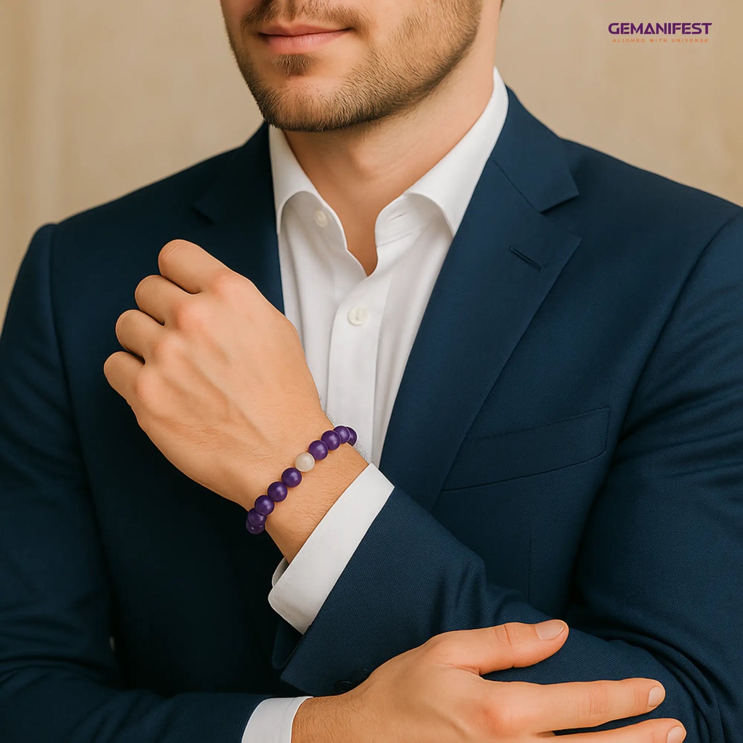 Man wearing a dark blue suit with a white shirt and a Amethyst bracelet, with 'GEMANIFEST' branding.