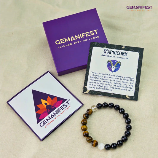 Capricorn bracelet with beads of Black tourmaline and tiger's eye on a beige background