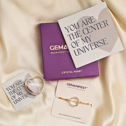 Clear quartz heart and bracelet on Gemanifest cards with text and branding.