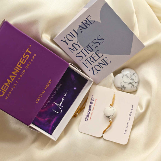 Gemanifest Howlite Heart crystal bracelet with packaging and card on a gray background