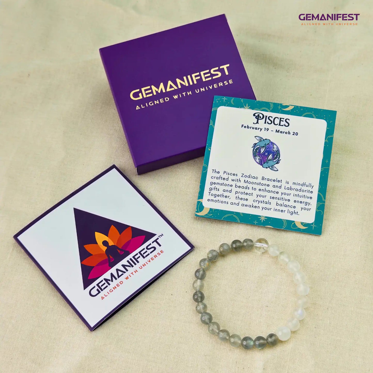 GEMANIFEST Pisces bracelet, cards, and packaging on a beige background
