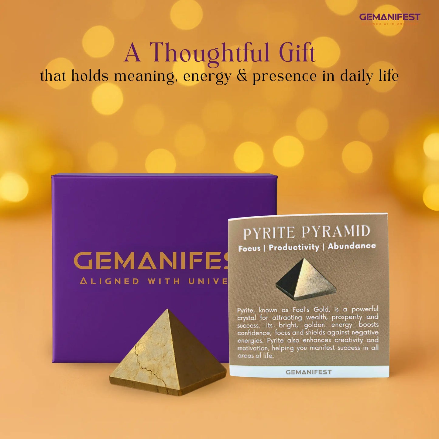 Pyrite pyramid with packaging and description on a blurred background