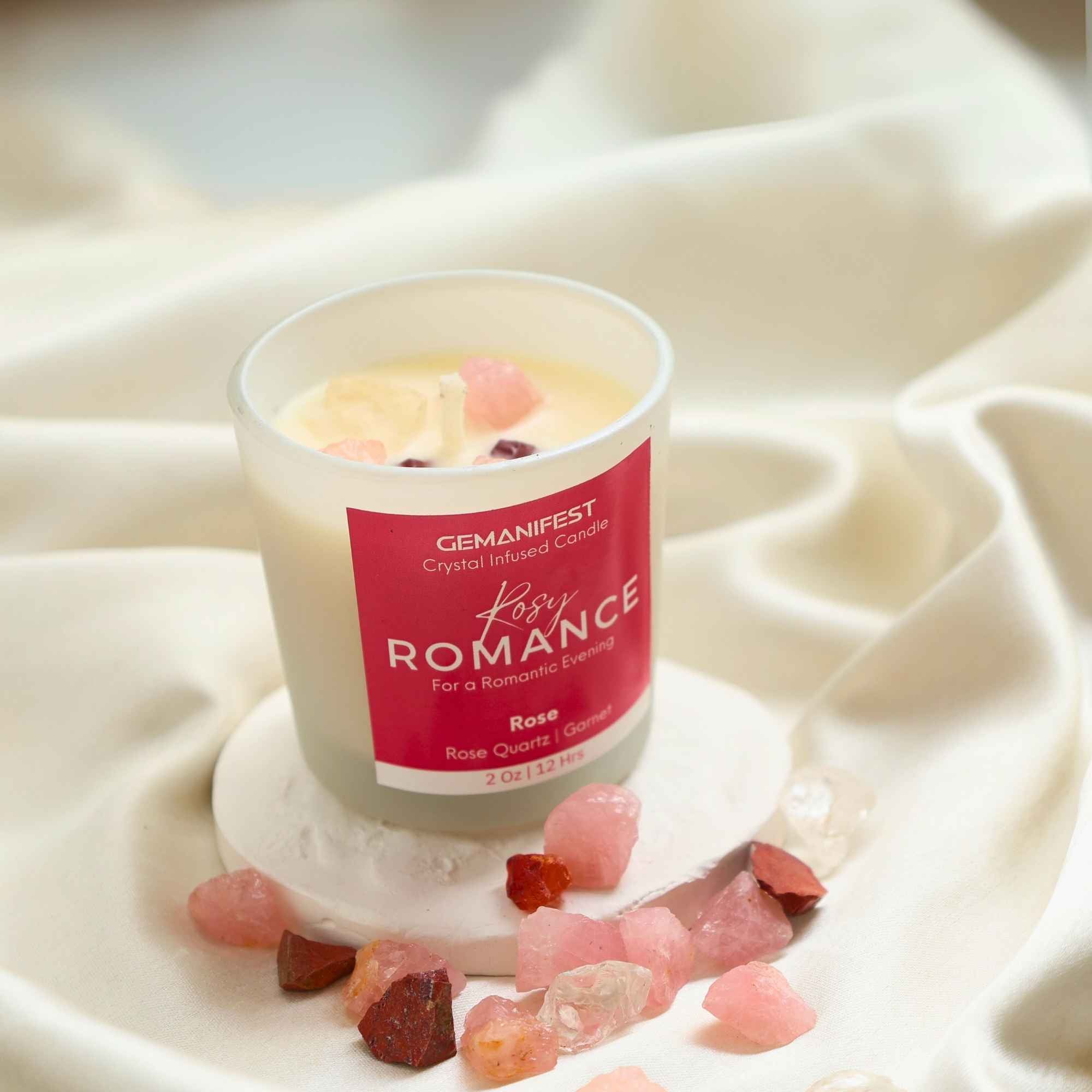 Rosy Romance Manifestation Candle with Rose Quartz and Garnet crystals and Rose essential oil for love and passion.