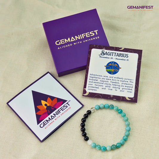 Sagittarius bracelet with amazonite and black tourmaline beads on a beige background