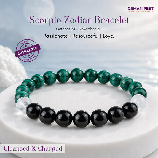 Scorpio zodiac bracelet with malachite and black tourmaline beads on a beige background