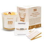 Candle with '333 Manifestation Candle' label on a surface with icons and text about soy wax, essential oil, and burn time.