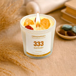 Gemanifest 333 angel number candle on creative background