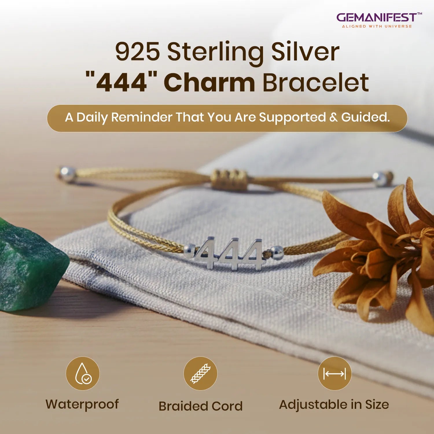 925 Sterling Silver '444' Charm Bracelet on a wooden surface with a stone and flower, featuring GEMANIFEST branding.