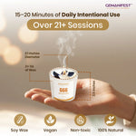 Gemanifest candle held in a hand with product details and brand name.