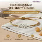 925 Sterling Silver '999' charm bracelet on a beige fabric background with GEMANIFEST branding.