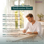 Man writing in a notebook with a 'Your Daily 1 Minute Manifestation Ritual' text overlay.