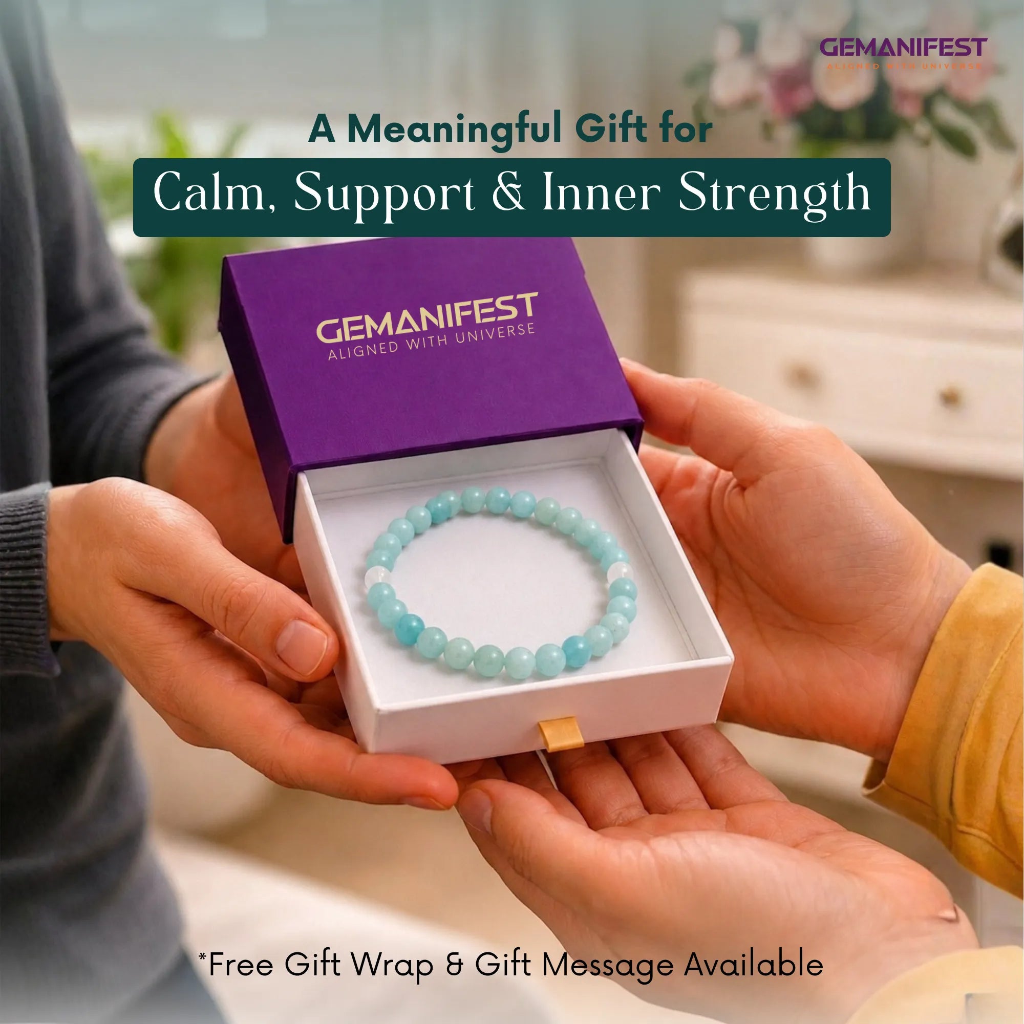 Turquoise beaded bracelet in a GEMANIFEST box held by two hands with a blurred indoor background.