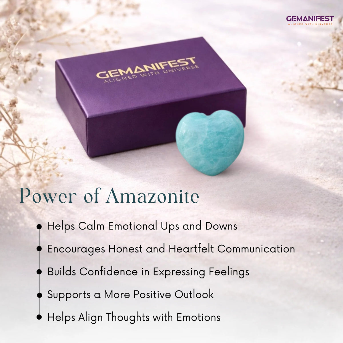 Amazonite stone and purple box with 'GEMANIFEST' branding on a light background
