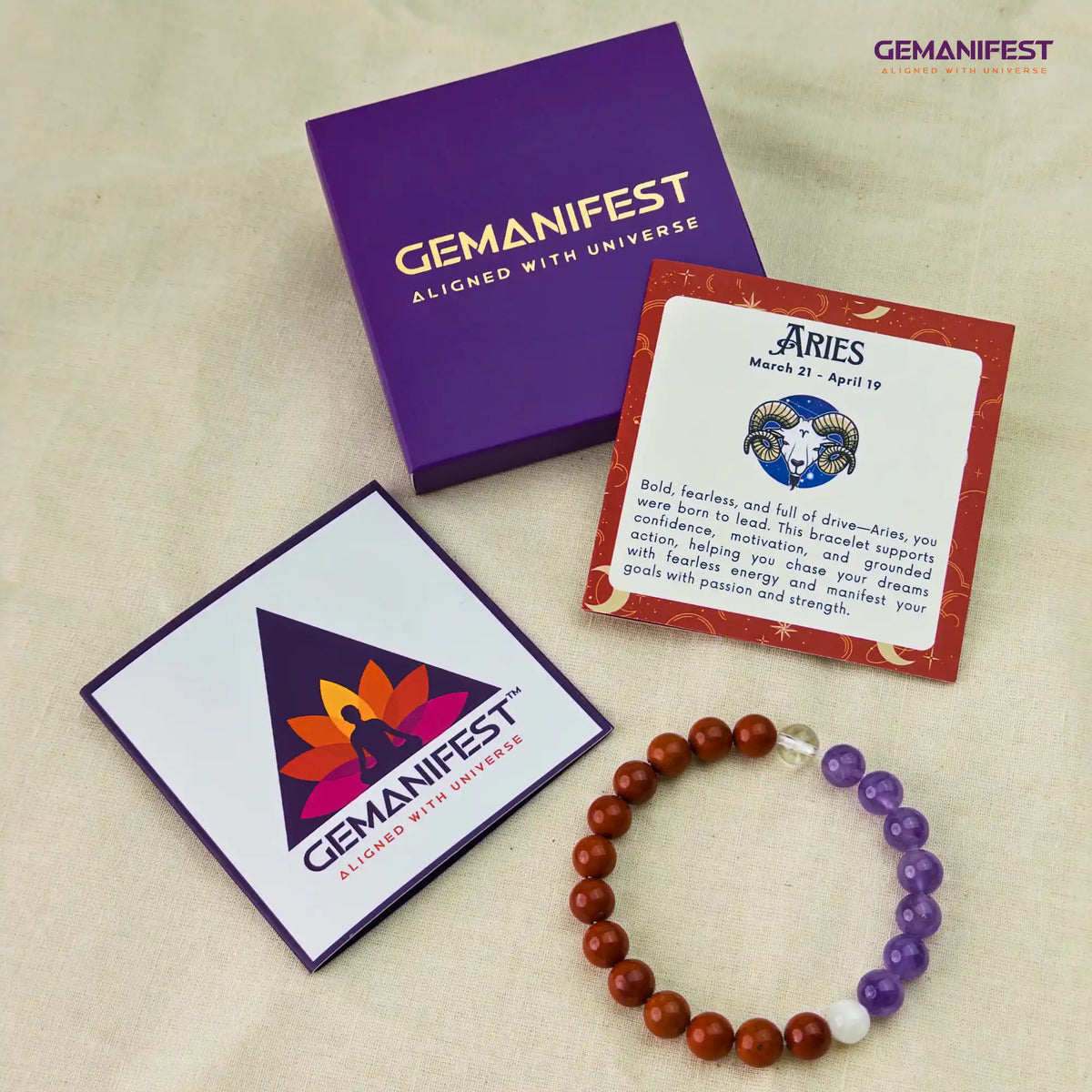 Gemanifest Aries bracelet with packaging and card on a beige background