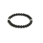 Black beaded bracelet on a white background