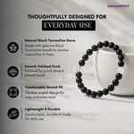 Black tourmaline bracelet with product features on a light background