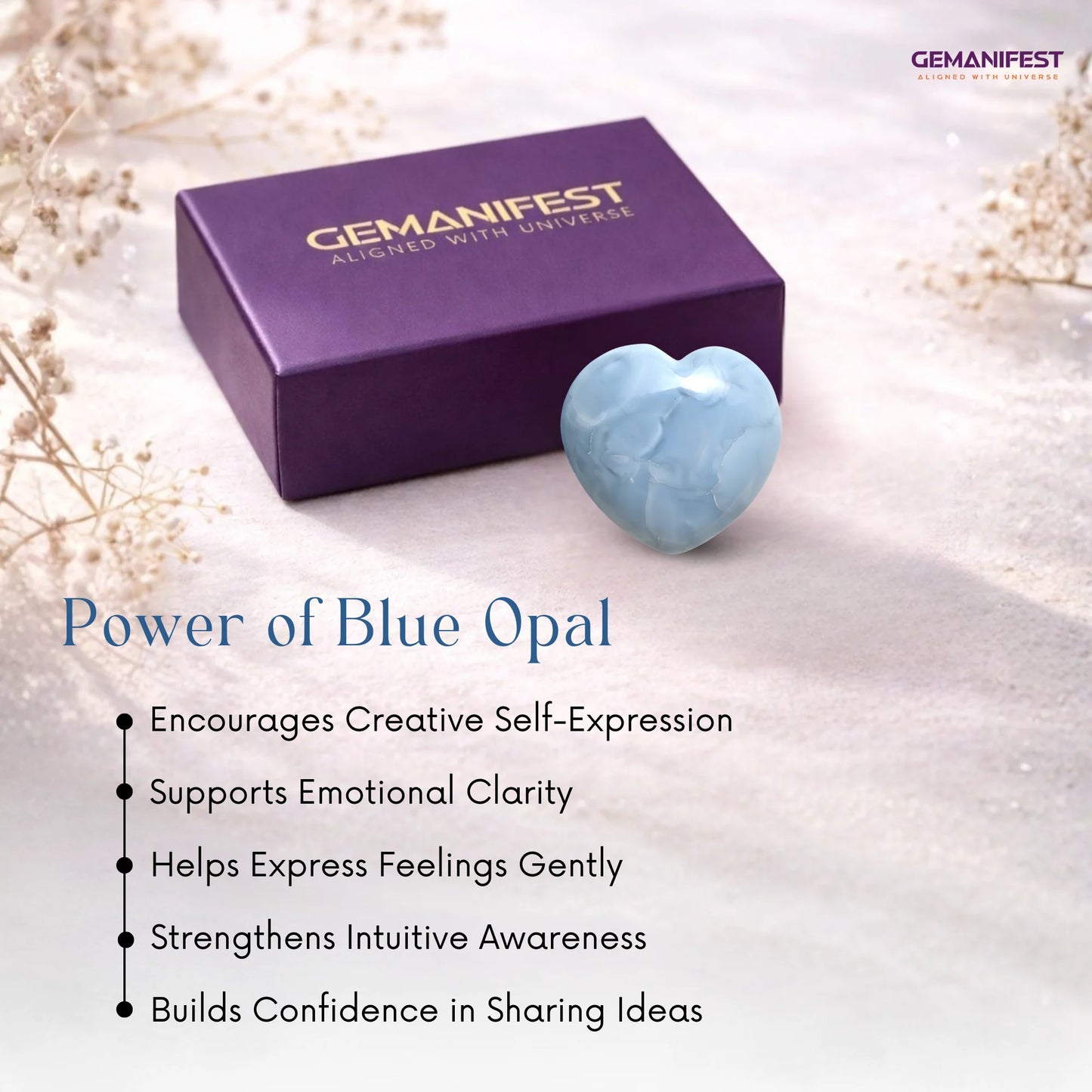Blue opal heart stone with Gemanifest box on a soft background