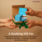 GEMANIFEST gift set with cards and candles being handed over on a beige background