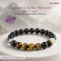 Capricorn bracelet with beads of Black tourmaline and tiger's eye on a beige background