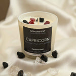 Capricorn Zodiac Manifestation Candle with Garnet and Black Tourmaline crystals and Cedarwood essential oil for discipline and protection.