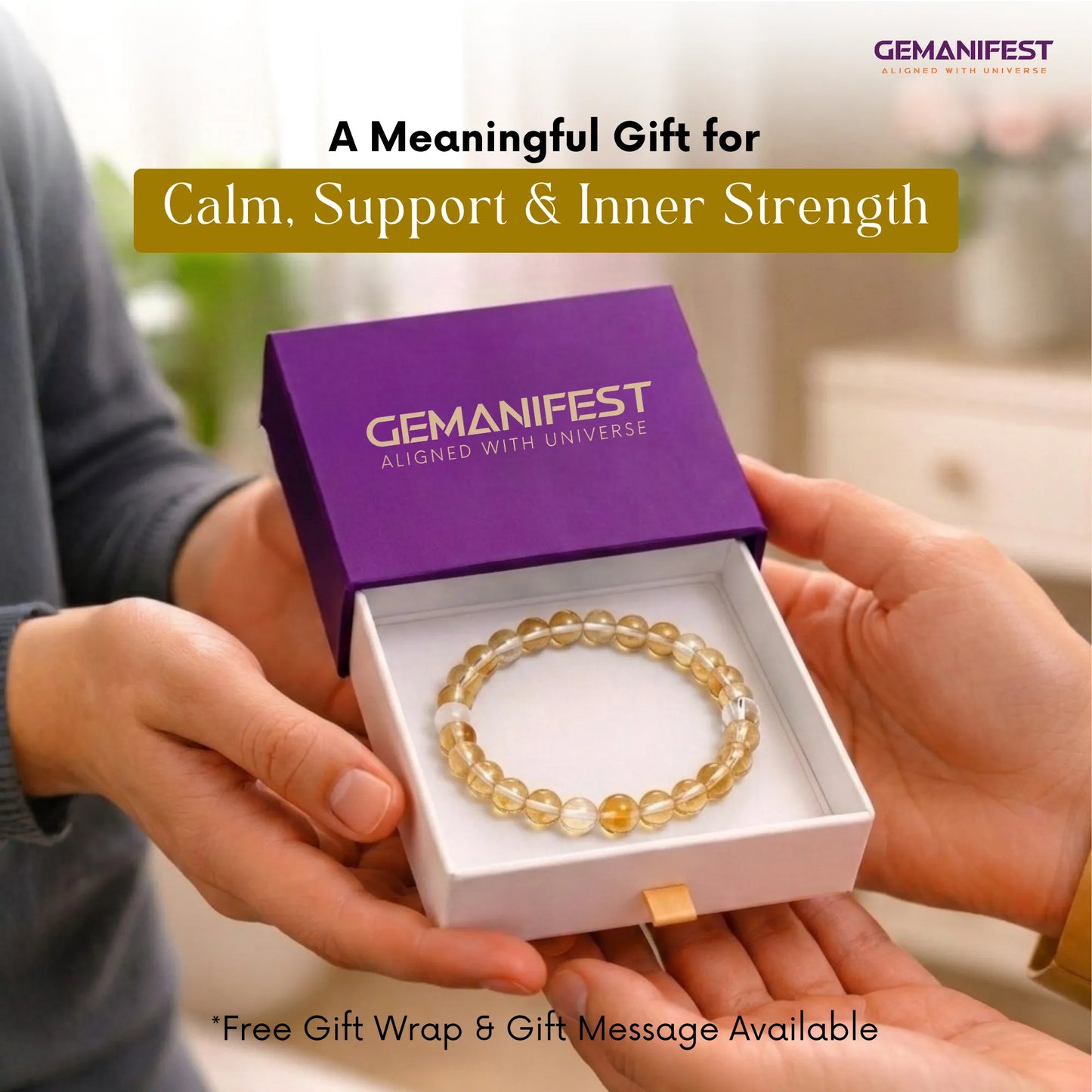 Gold beaded bracelet in a GEMANIFEST box held by two hands with promotional text.
