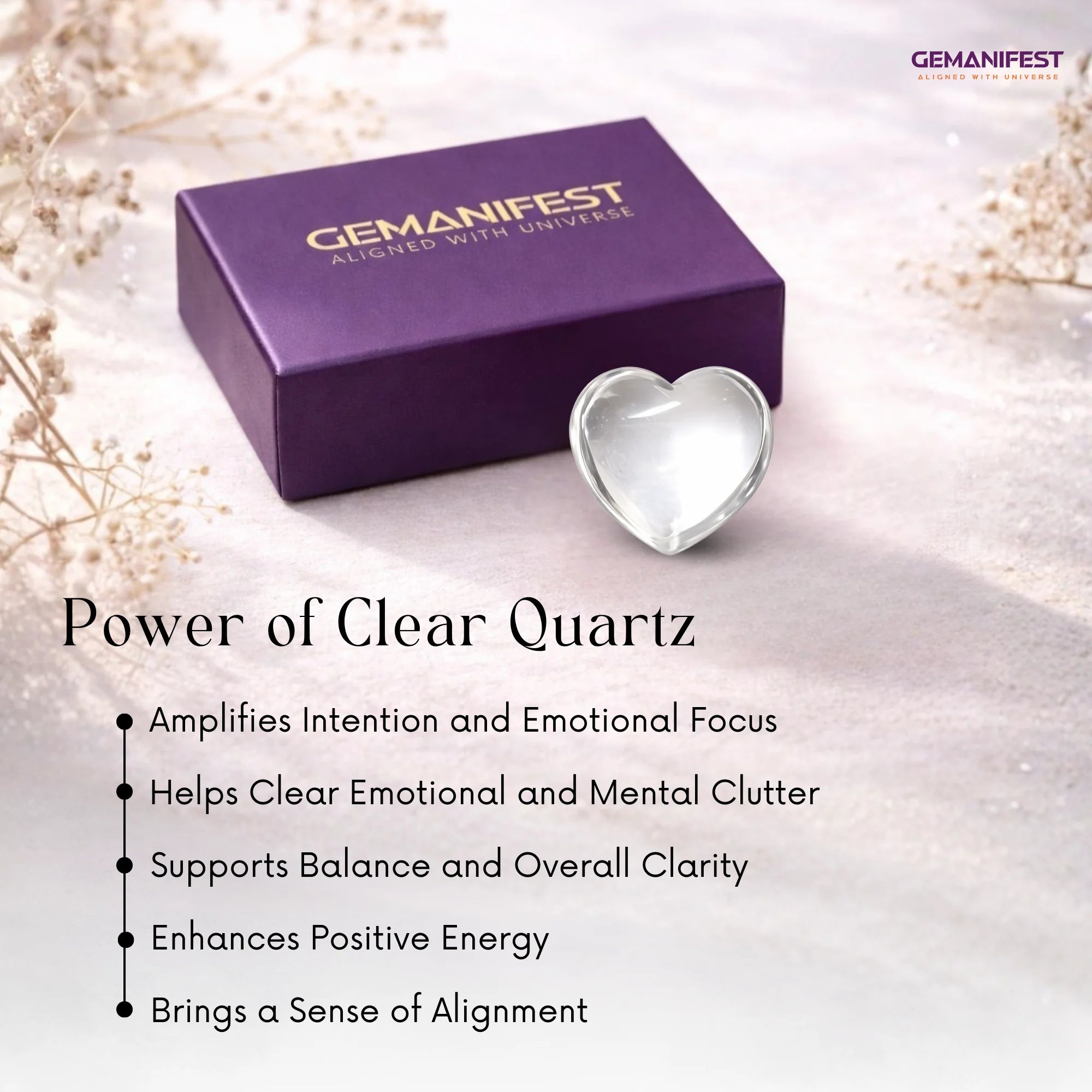 Heart-shaped clear quartz crystal with Gemanifest box on a light background