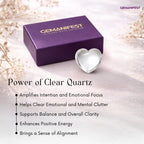 Heart-shaped clear quartz crystal with Gemanifest box on a light background