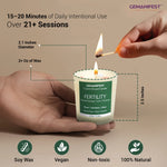 Hand holding fertility candle showing size (2.5 inches tall, 2.1 inches wide, 2 oz soy wax).