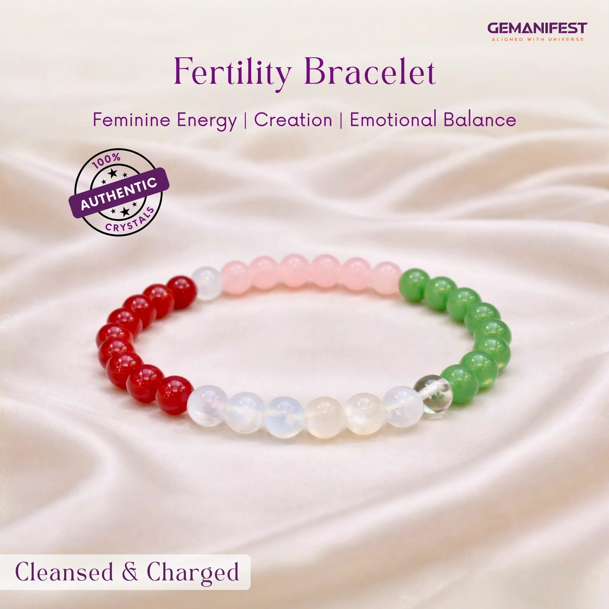 Fertility bracelet with red, white, and green beads on a soft fabric background