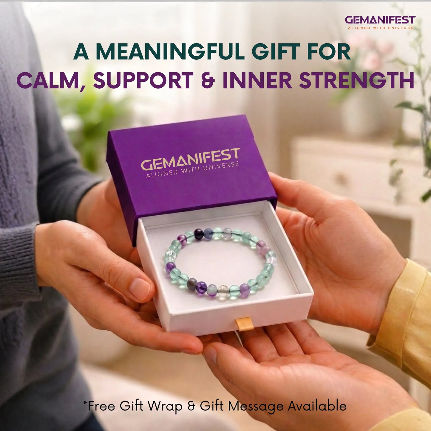 Gemanifest bracelet in a box held by two hands with a blurred indoor background