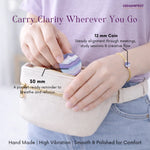 Person holding a small pouch with a coin and text about product features.