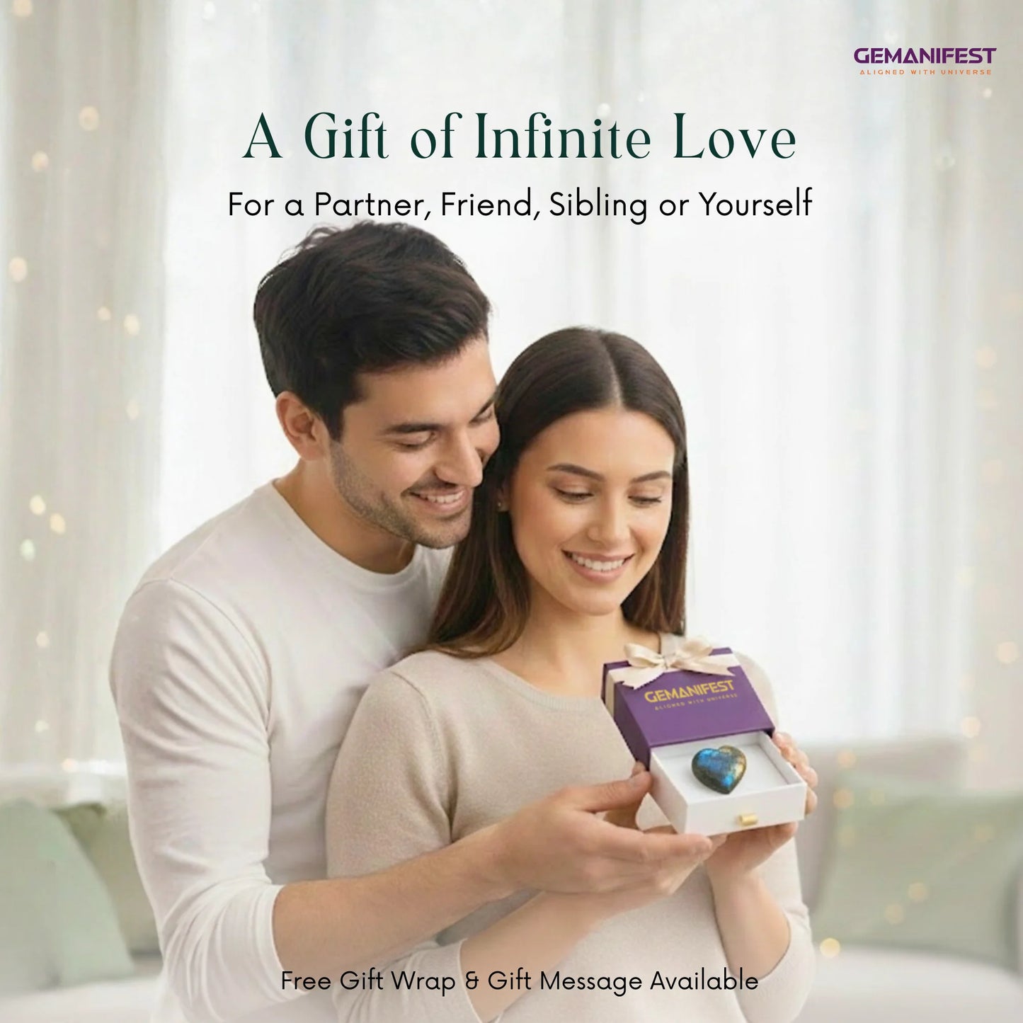 Couple holding a box with a gemstone, surrounded by soft lighting and blurred background.