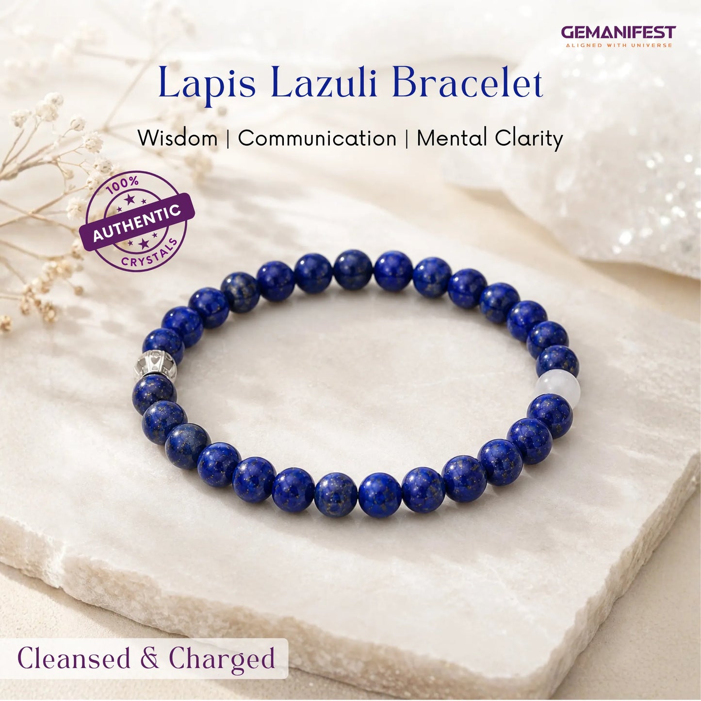 Lapis Lazuli bracelet on a white stone surface with GEMANIFEST branding.