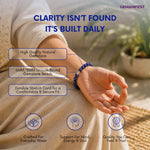 Person wearing a blue gemstone bracelet with product features highlighted, set against a blurred natural background.