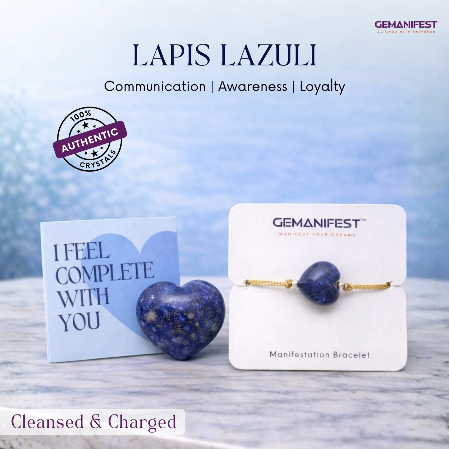 Lapis Lazuli heart-shaped bracelet on a display card with 'GEMANIFEST' branding, against a blurred natural background.