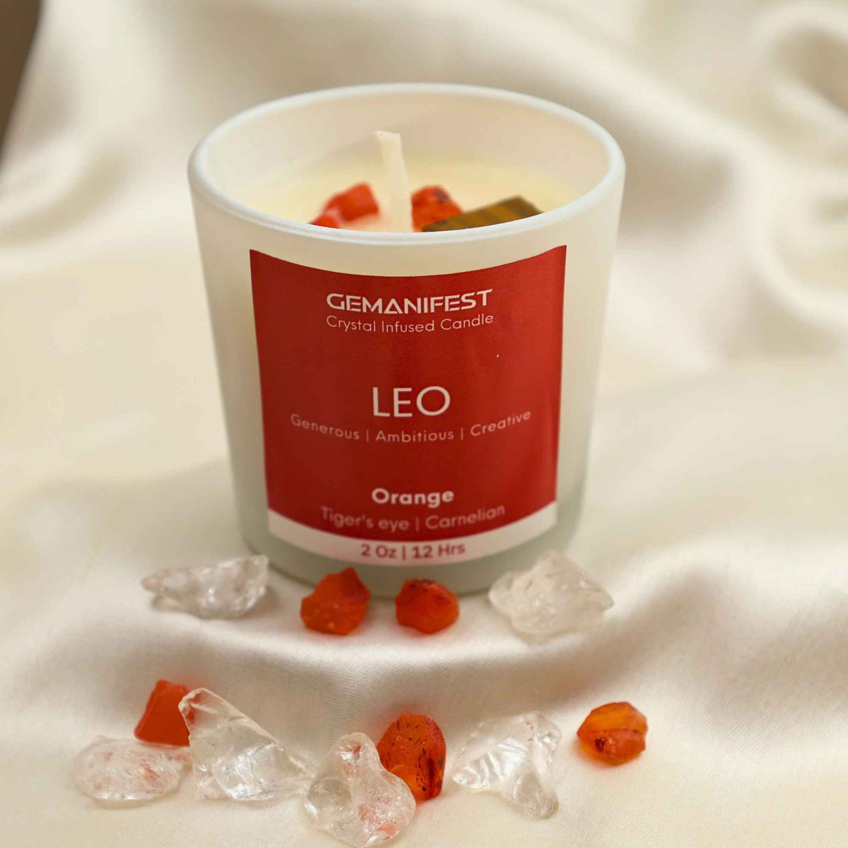 Leo Zodiac Manifestation Candle with Carnelian and Tiger’s Eye crystals and Sweet Orange essential oil for courage and creativity.
