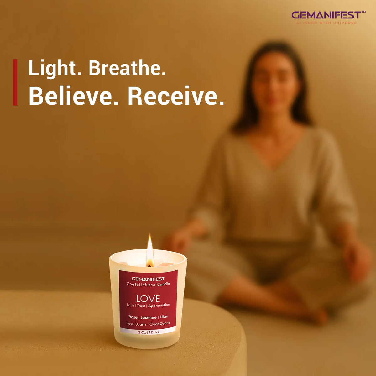 Love manifestation candle placed in front of meditating person.