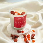 Make It Happen Manifestation Candle with Carnelian and Red Jasper crystals and Sandalwood essential oil for motivation and courage.