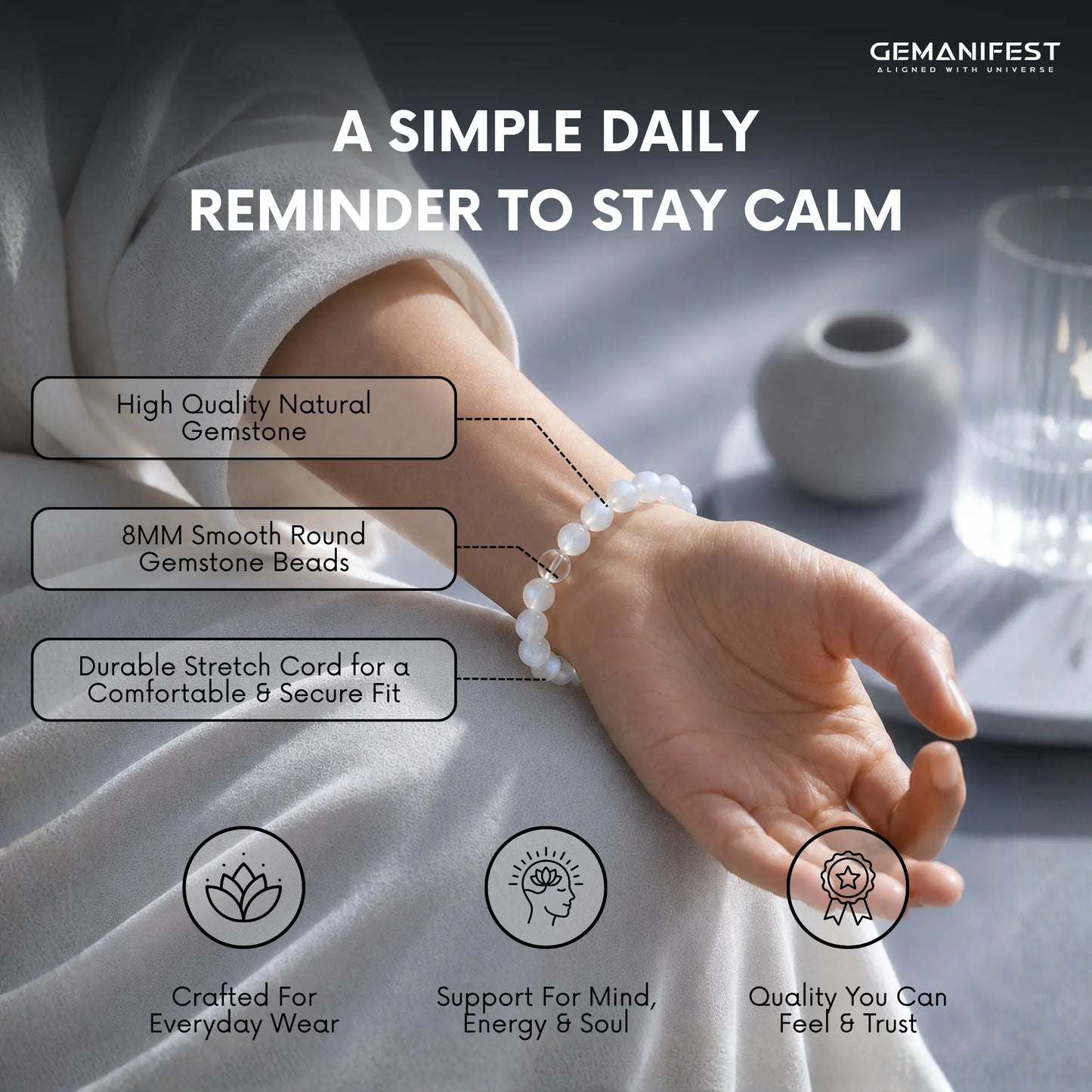 Hand wearing a bracelet with text highlighting features and GEMANIFEST branding.