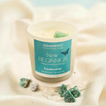 New Beginnings Manifestation Candle with Amazonite and Moonstone Crystals for Fresh Starts, Renewal, and Endless Possibilities.
