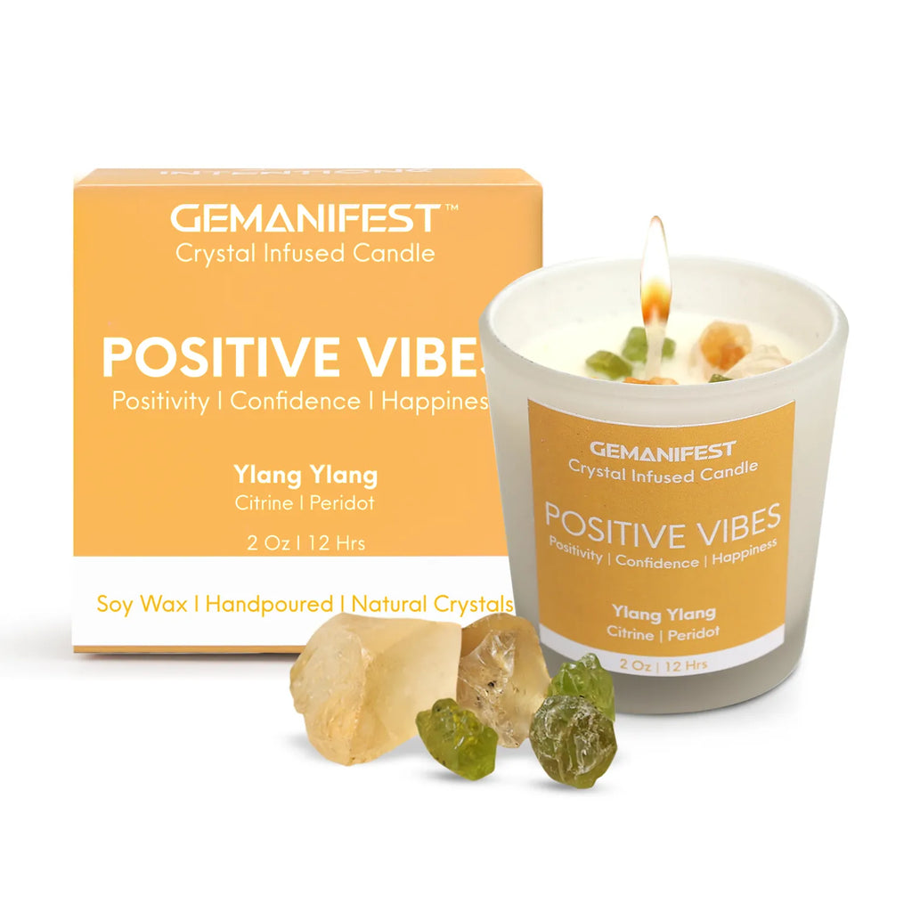 Gemanifest Positive Vibes crystal infused candle with packaging and crystals on a white background