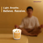 Positive Vibes manifestation candle placed in front of meditating person.