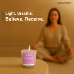 Pregnancy manifestation candle placed in front of meditating woman.