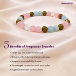 Multicolored beaded pregnancy bracelet on a soft fabric background with text listing benefits.