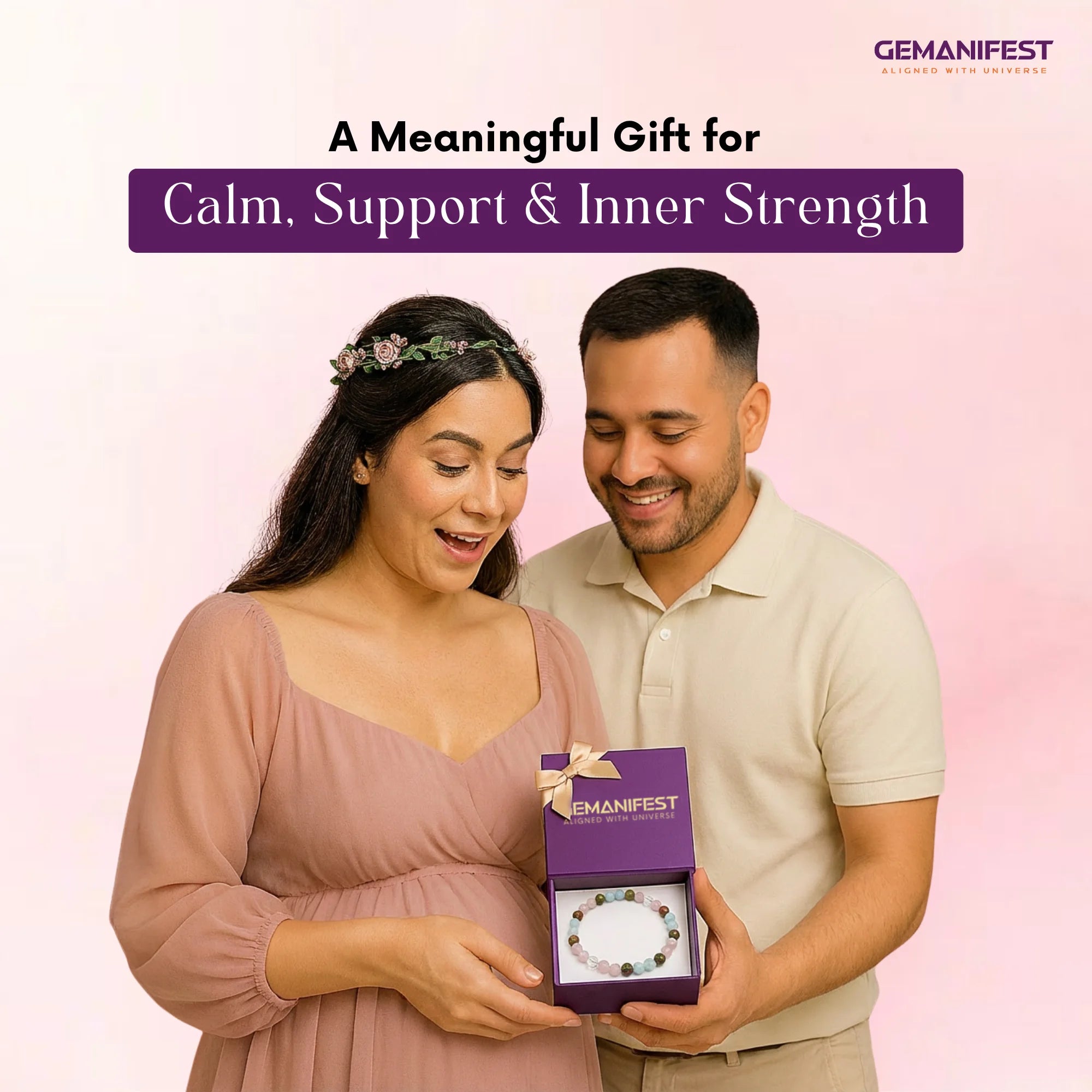 Man presenting a purple gift box to a woman with 'GEMANIFEST' branding on a pink background.